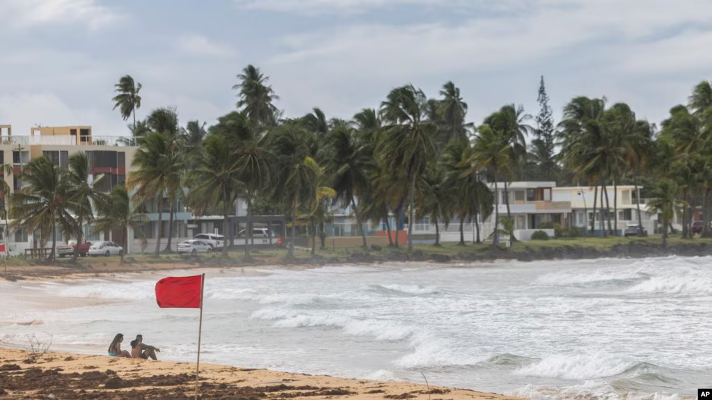 Ernesto becomes a hurricane after brushing past Puerto Rico